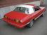 Bright Red 78 Mustang II Ghia Coupe with White Vinyl Roof