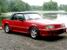 1992 Bright Red Mustang GT Convertible front right view with top up