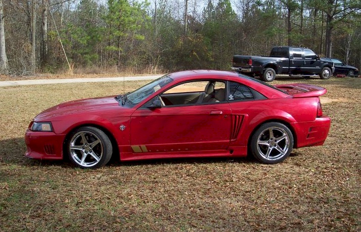 Laser Red 1999 Mustang Saleen S-351 coupe, left side view. 
