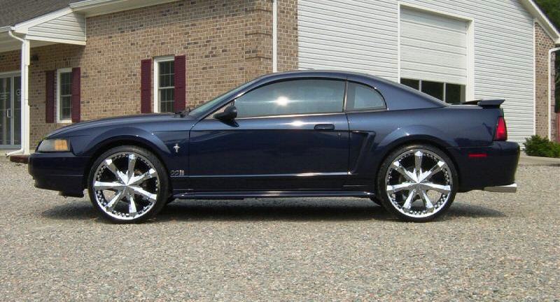 Blue 2001 Mustang with custom wheels